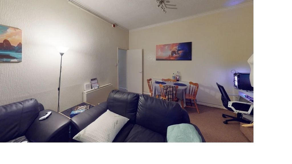 Property photo 3 of 5 A Contemporary Living Room With A Comfortable Blac...