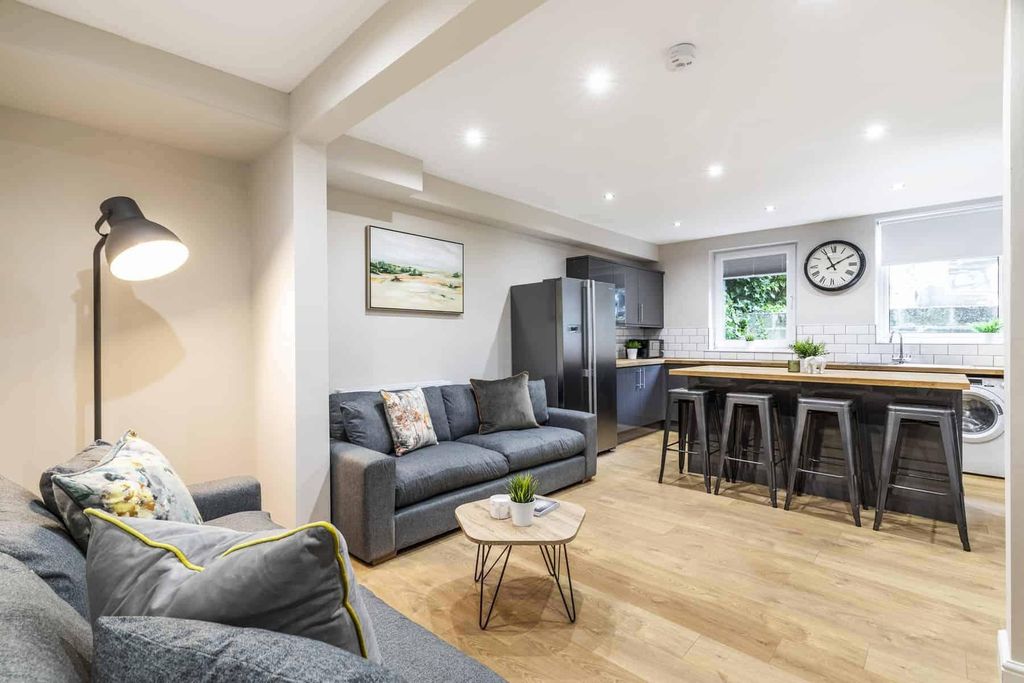 Property photo 1 of 7 A Modern, Spacious Living Room With Ample Seating,...