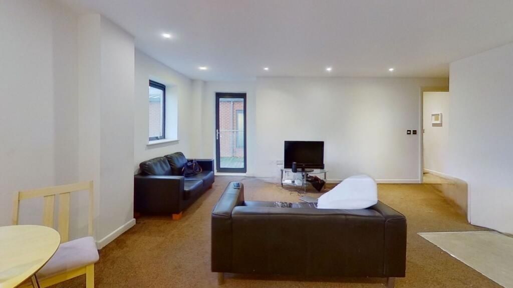 Property photo 1 of 5 A Modern Living Room With Comfortable Dark Leather...