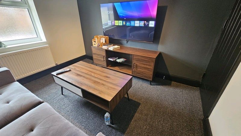 Property photo 2 of 8 Modern And Comfortable Living Room Featuring A Lar...