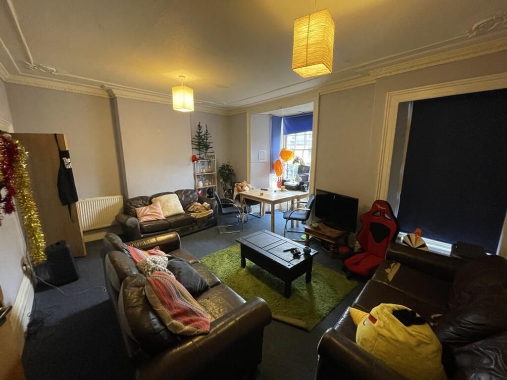 Property photo 1 of 12 A Spacious Living Room Featuring Comfortable Leath...