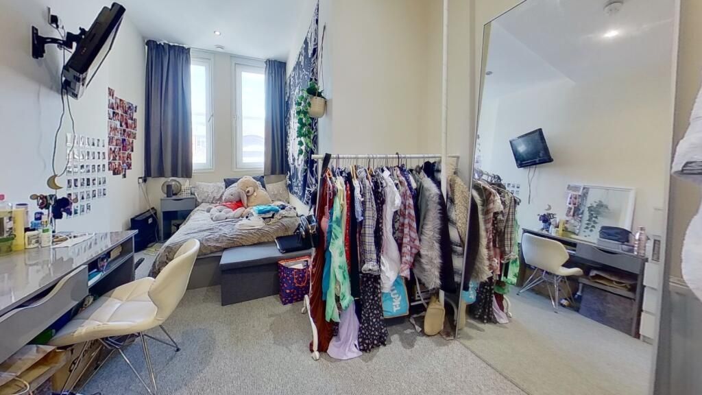 Property photo 2 of 14 Compact And Tidy Space Featuring A Clean Toilet Ar...