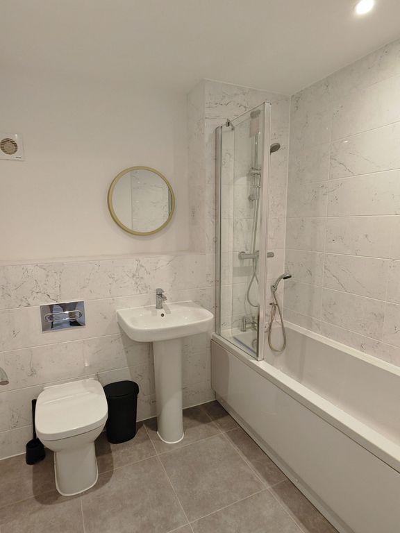 Property photo 2 of 12 A Modern Bathroom Suite Featuring A Clean White Ba...