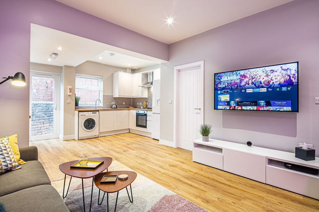 Property photo 1 of 23 Bright And Modern Living Room Featuring A Large Fl...