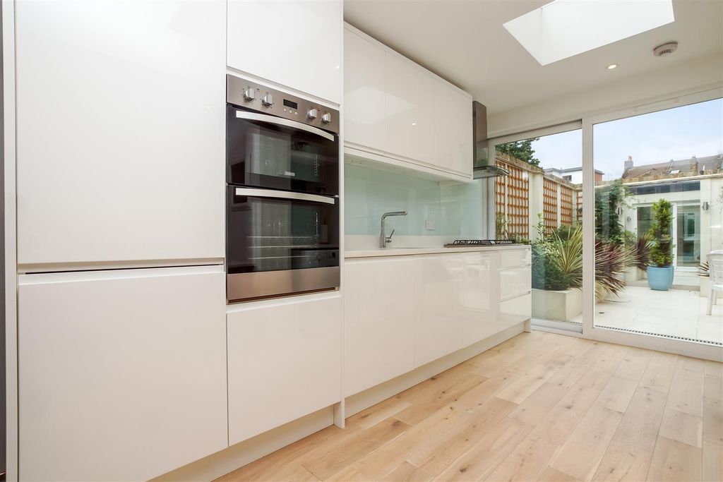 Property photo 1 of 11 White Laquerd Contemporary Style Kitchen
