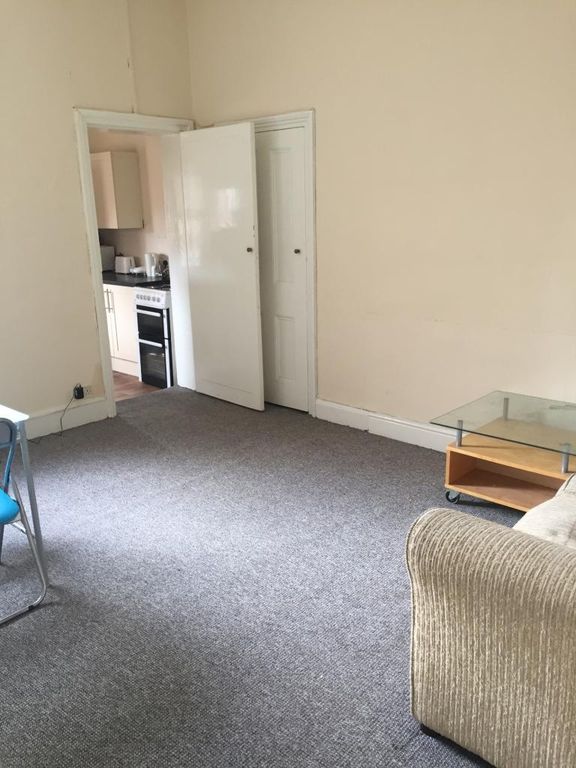 Property photo 1 of 7 A Bright Living Room Featuring Neutral Walls And c...