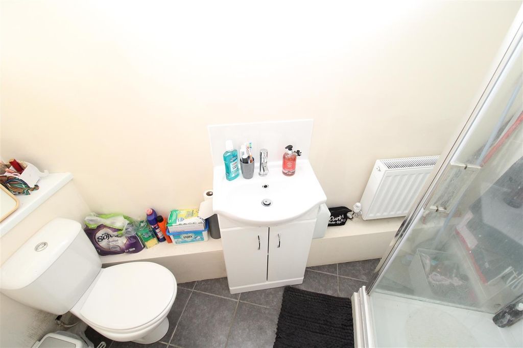 Property photo 1 of 5 Bright Bathroom With Modern Vanity And Shower...
