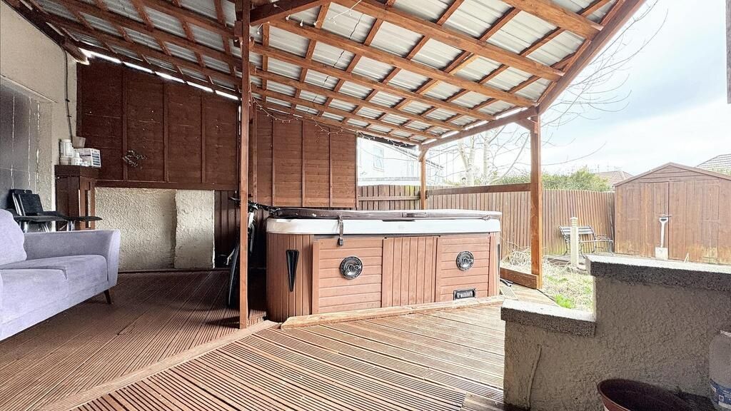 Property photo 2 of 8 Relaxing Covered Deck With Hot Tub And Seating...