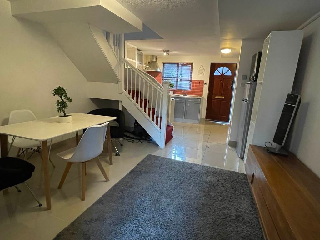 Property photo 3 of 5 A Warm And Inviting Living Area Featuring A Modern...