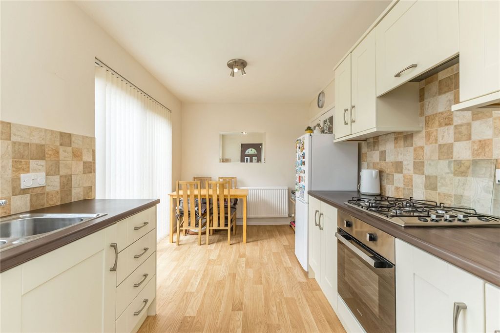 Property photo 3 of 16 Dining Kitchen