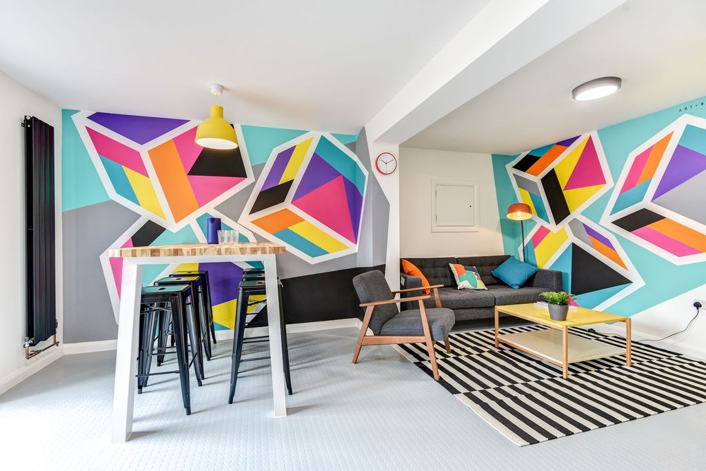 Property photo 3 of 6 This Vibrant Living Room Features Stylish Decor Wi...
