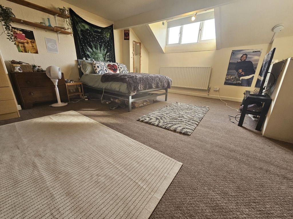 Property photo 1 of 12 Bright And Spacious Master Bedroom Featuring A Com...