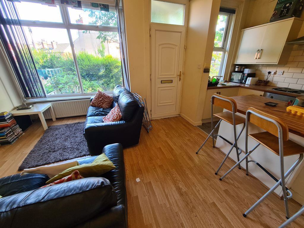 Property photo 3 of 21 Bright And Inviting Living Room Featuring Large Wi...