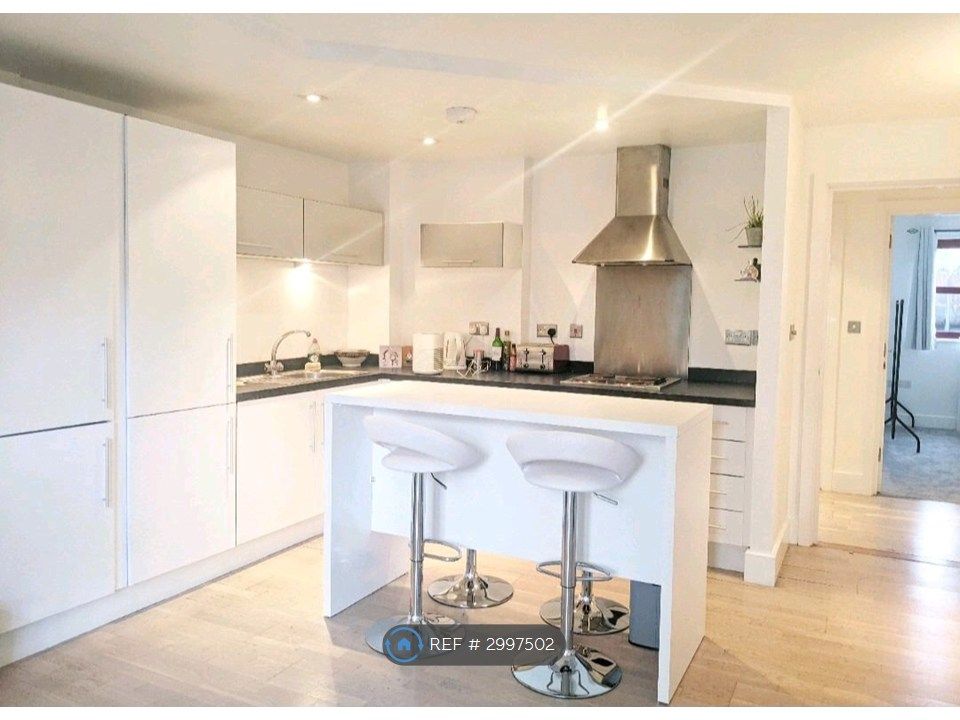 Property photo 2 of 9 Open Kitchen With 4 Bar Stools