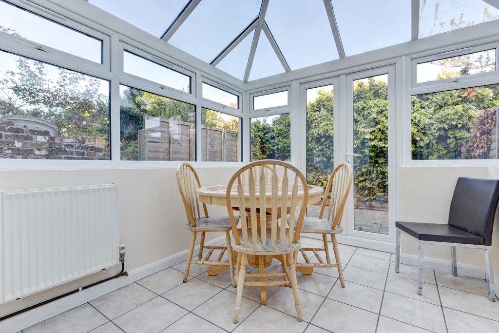 Property photo 1 of 22 Bright Conservatory-Style Dining Area With Large W...