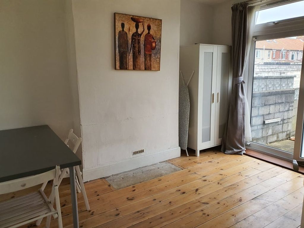 Property photo 2 of 11 A Cozy Living Room Featuring Warm Wooden Floors, A...