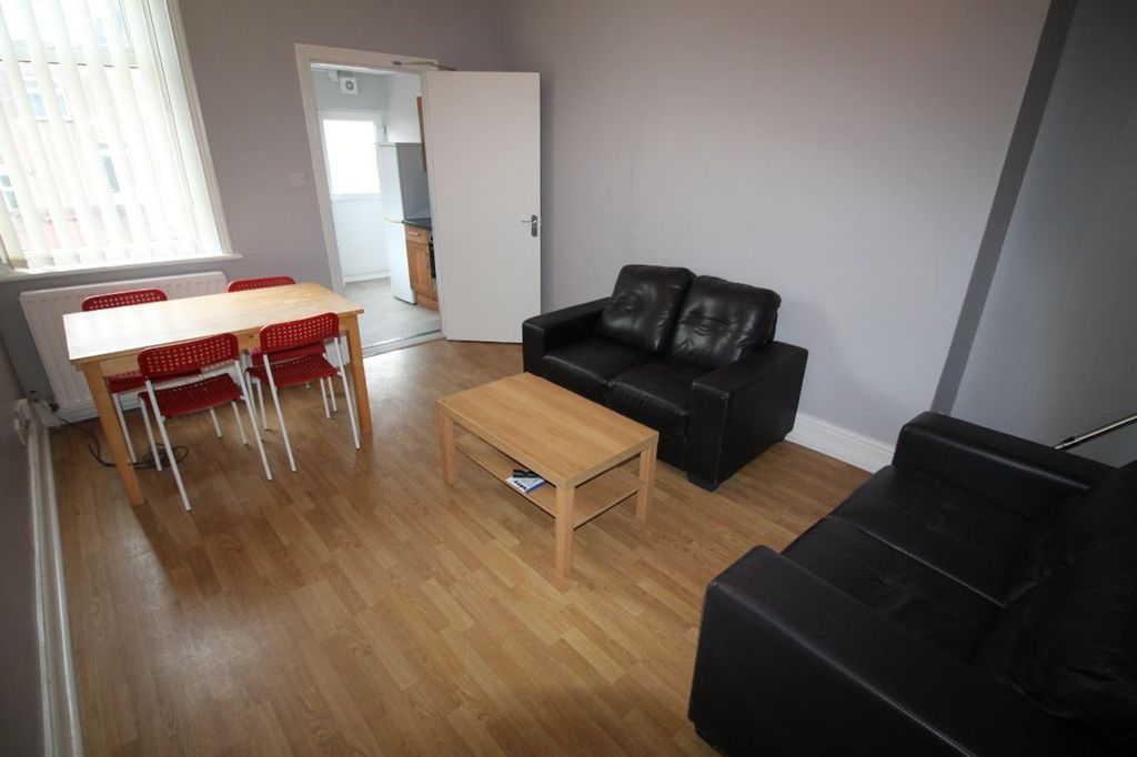Property photo 2 of 14 Spacious Living Room Featuring Comfortable Seating...