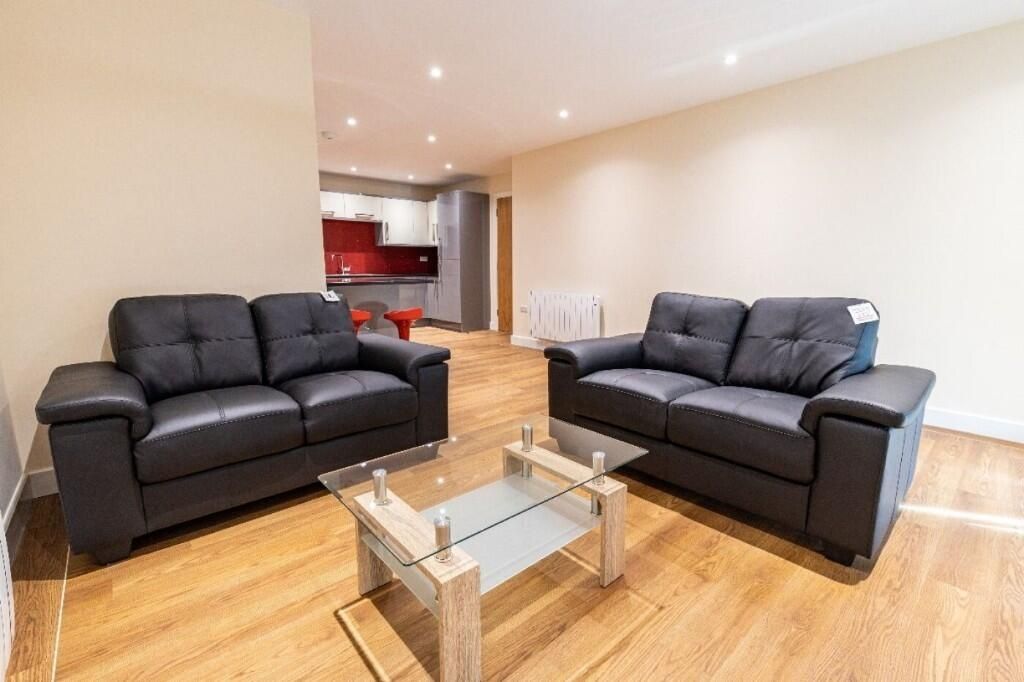 Property photo 1 of 9 A Modern Living Room Featuring Two Black Leather S...