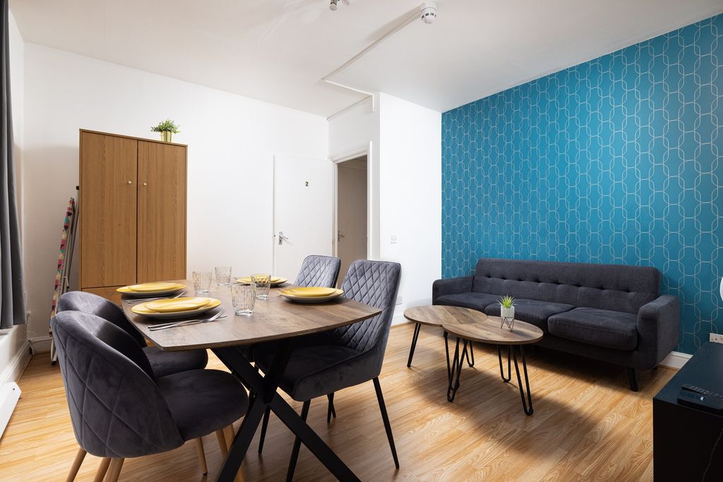 Property photo 1 of 8 A Stylish And Inviting Living Room Perfect For Soc...