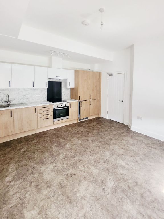 Property photo 1 of 10 Bright, Modern Open-Plan Kitchen With Light Wood c...