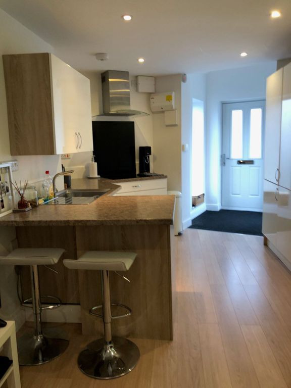 Property photo 2 of 11 Modern Open-Plan Kitchen With A Breakfast Bar And ...