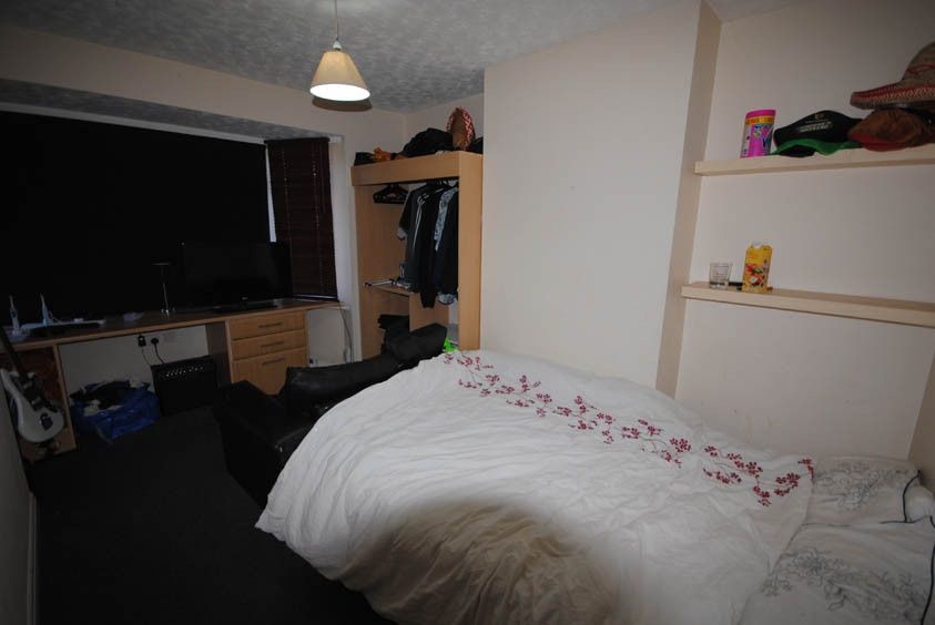 Property photo 3 of 5 A Bright And Cozy Bedroom Featuring A Neatly Made ...