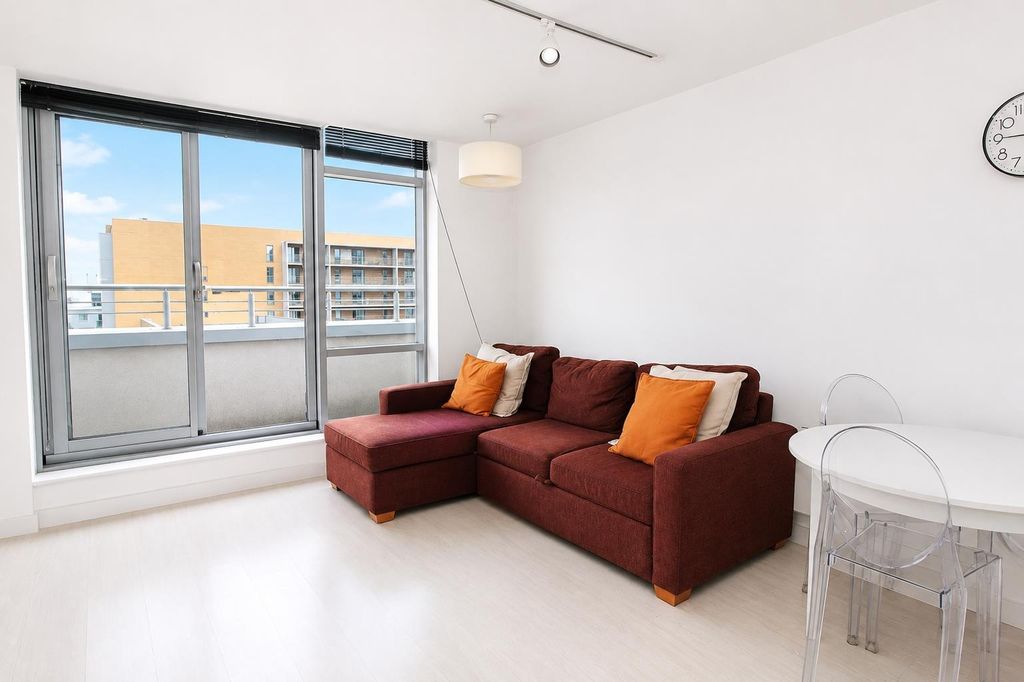 Property photo 2 of 9 Bright Living Room With Cozy Sofa And Large Window...