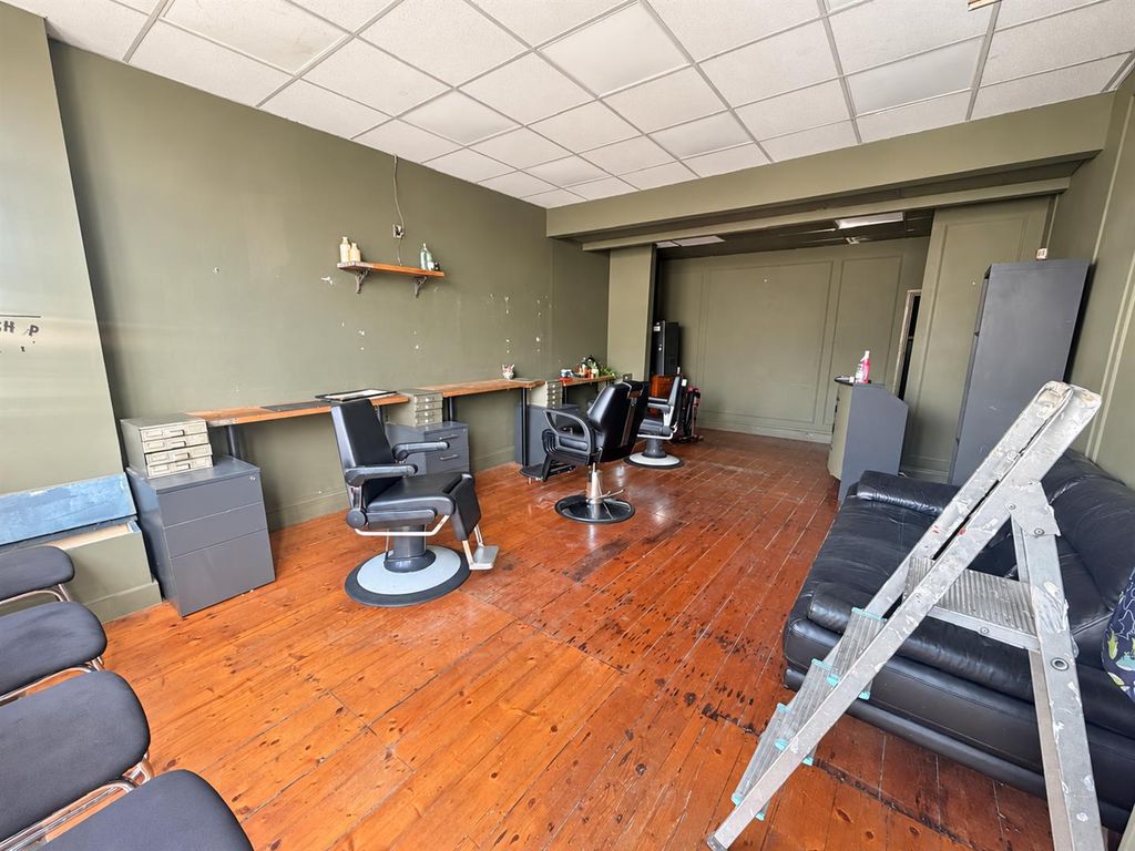 Property photo 2 of 10 Naturally Brightened Barbershop Interior.Png