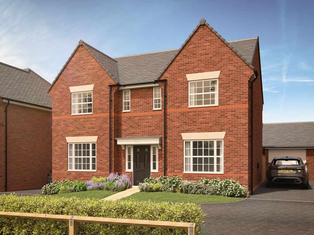 Property photo 1 of 11 A Red Brick House With Manicured Bushes And Flowers In The Foreground Sits Under A Bright Blue Sky W