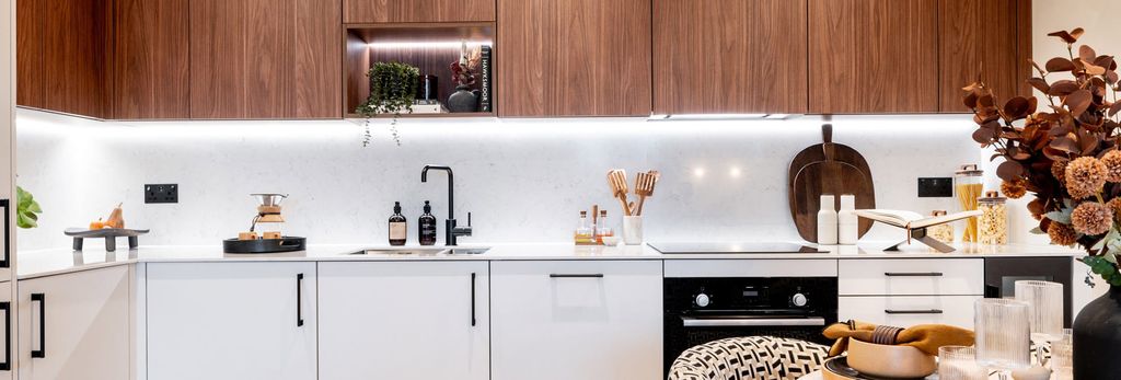 Property photo 2 of 4 Closeup Photo Of Decorated Dining Table, Kitchenette With Wooden-Finish Cupboards, White Cabinets