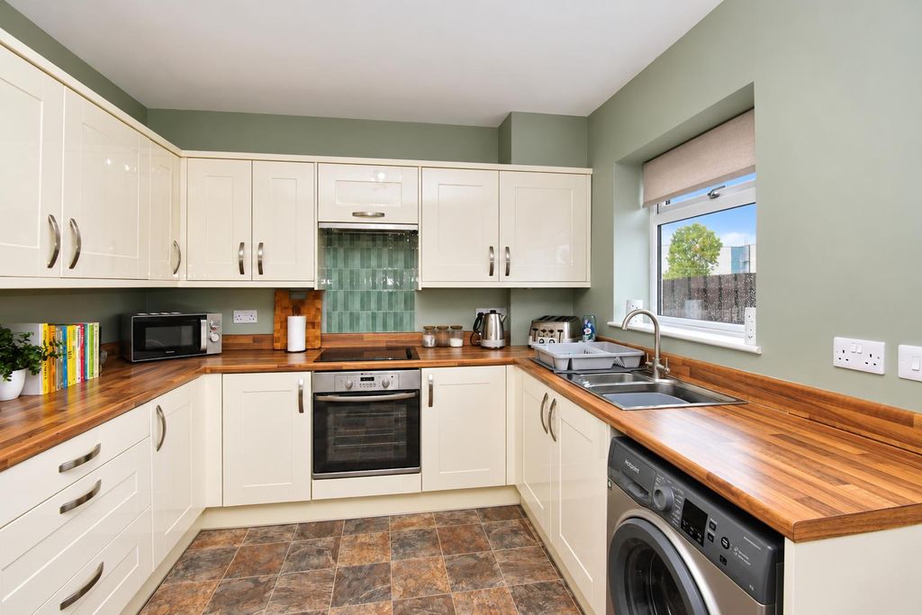 Property photo 3 of 16 Modern Sage-Green U-Shaped Kitchen.Png