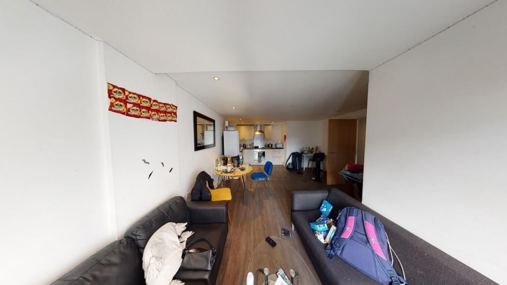 Property photo 3 of 9 Bright And Spacious Living Room Featuring Comforta...