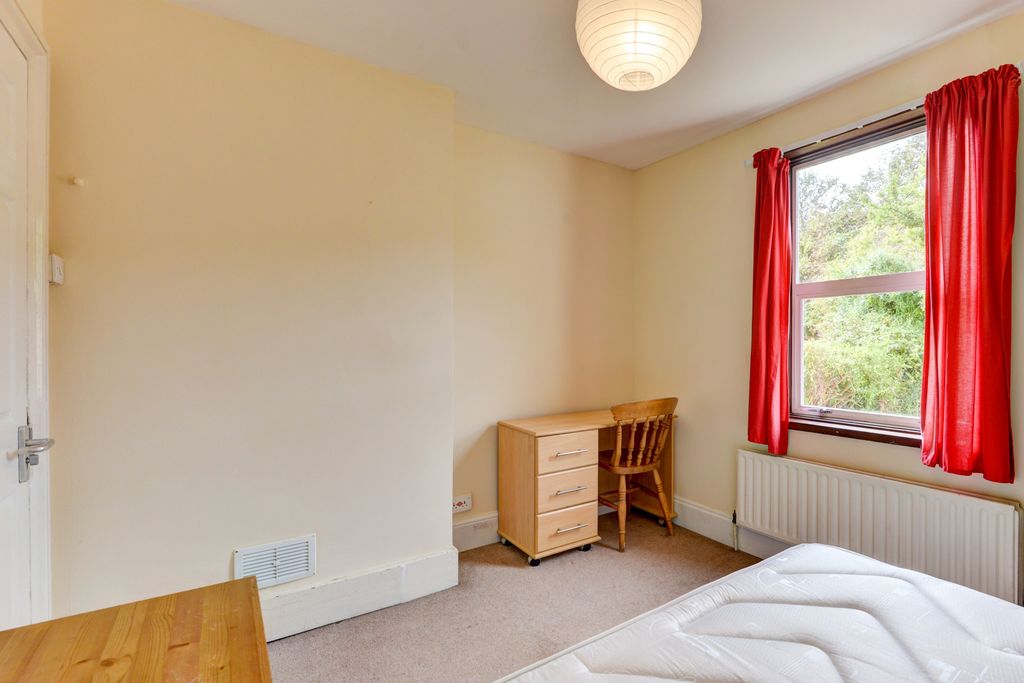 Property photo 2 of 19 A Bright And Tidy Bedroom With A Large Window Dres...