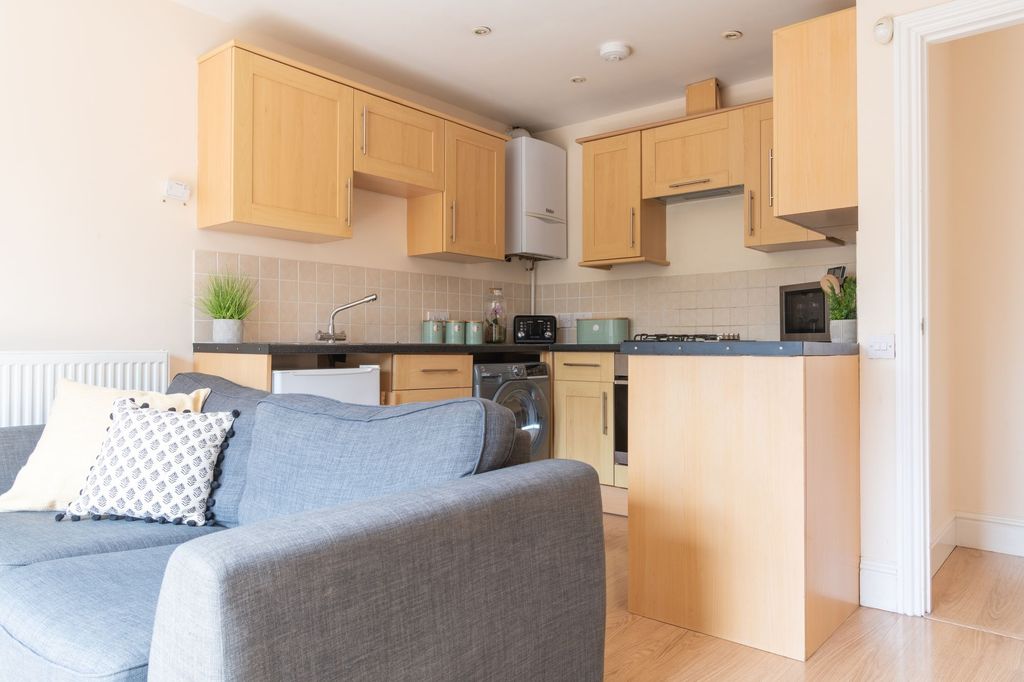Property photo 2 of 9 Bright Open-Plan Kitchen With Light Wood Cabinetry...