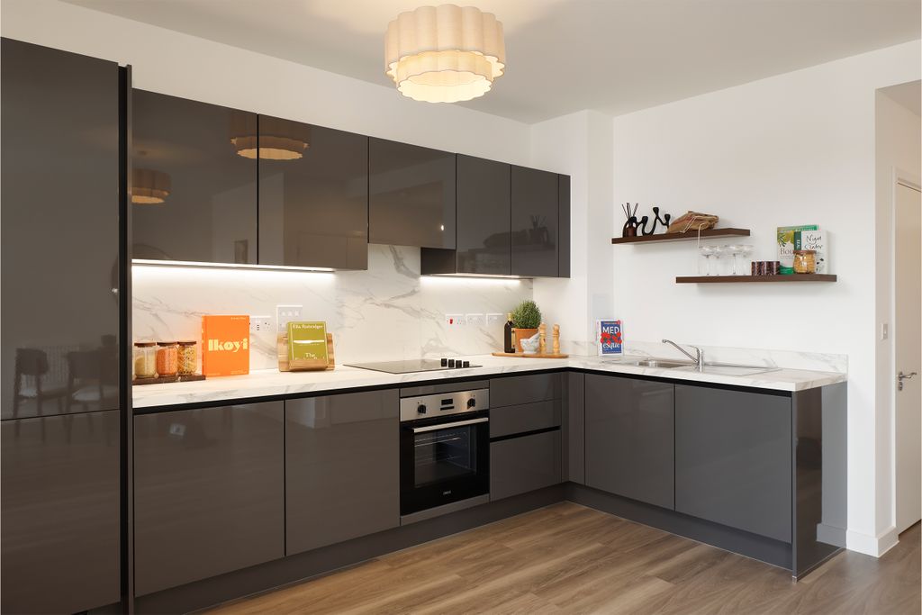 Property photo 3 of 6 Angled Photograph Towards Grey Kitchen With Dark Wood Flooring