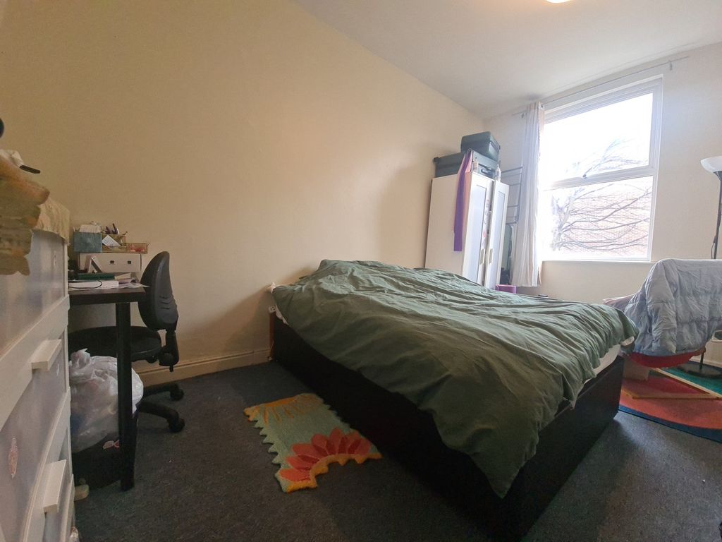 Property photo 1 of 4 A Modest Bedroom Featuring A Bed And A Window That...