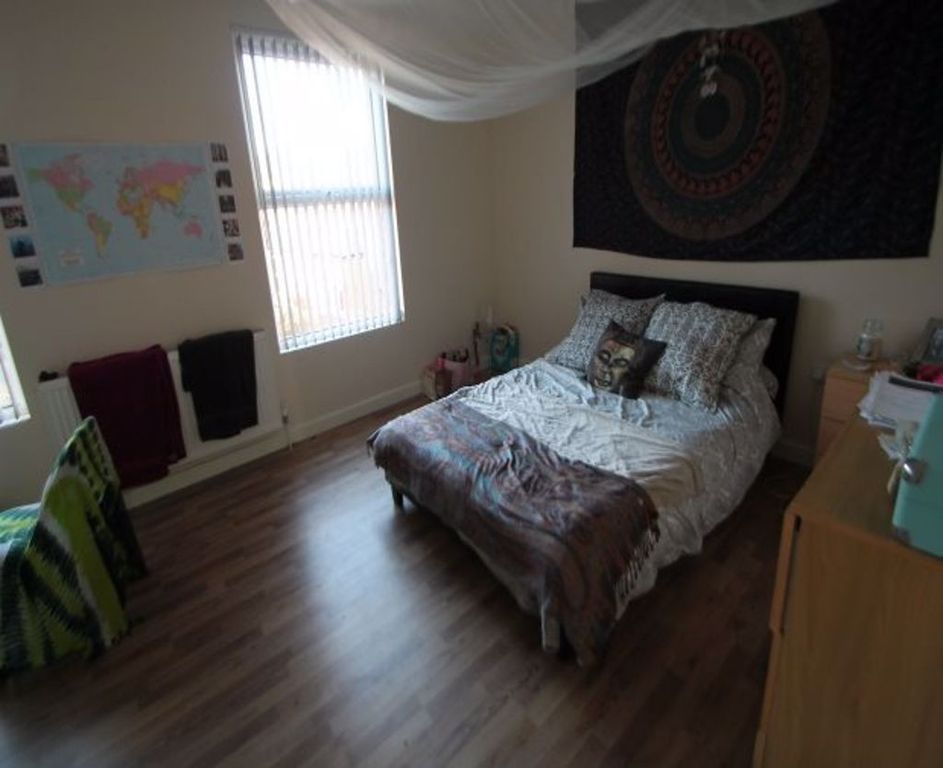 Property photo 1 of 28 A Spacious And Inviting Bedroom Featuring A Comfor...
