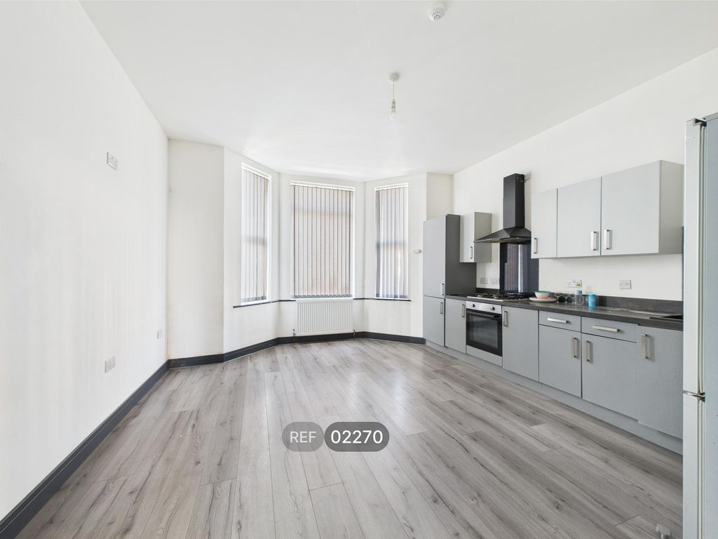 Property photo 1 of 11 Kitchen & Living Area