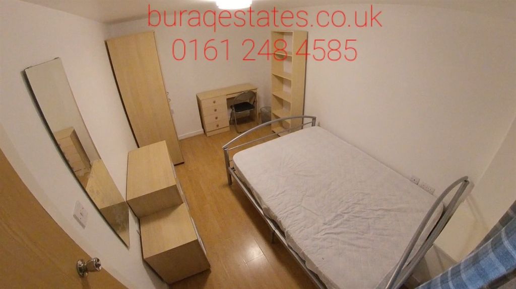 Property photo 3 of 5 A Cozy Single Bedroom Featuring A Bed And Minimal ...