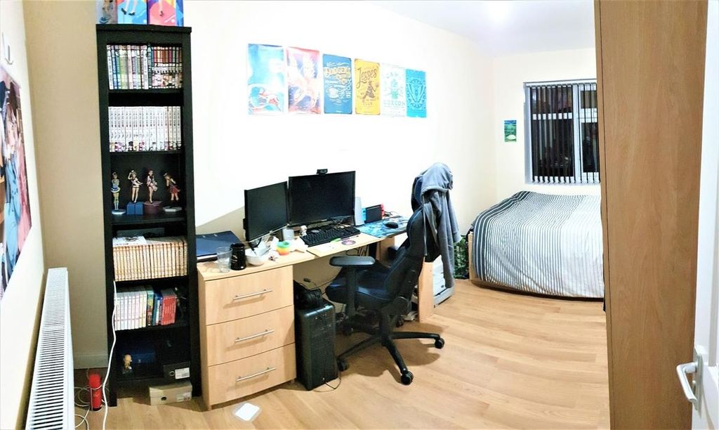 Property photo 3 of 10 A Well-Organized Bedroom Featuring A Comfortable d...