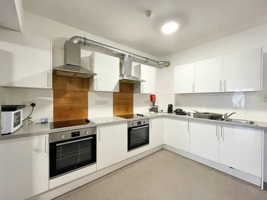 Property photo 3 of 5 Modern, Bright Kitchen With Ample White Cabinetry,...