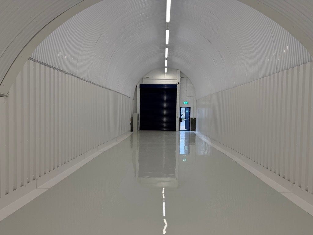 Property photo 2 of 4 An Empty Arch With White Lining, Facing The Front Electric Roller Shutter Entrance, Which Is Open.