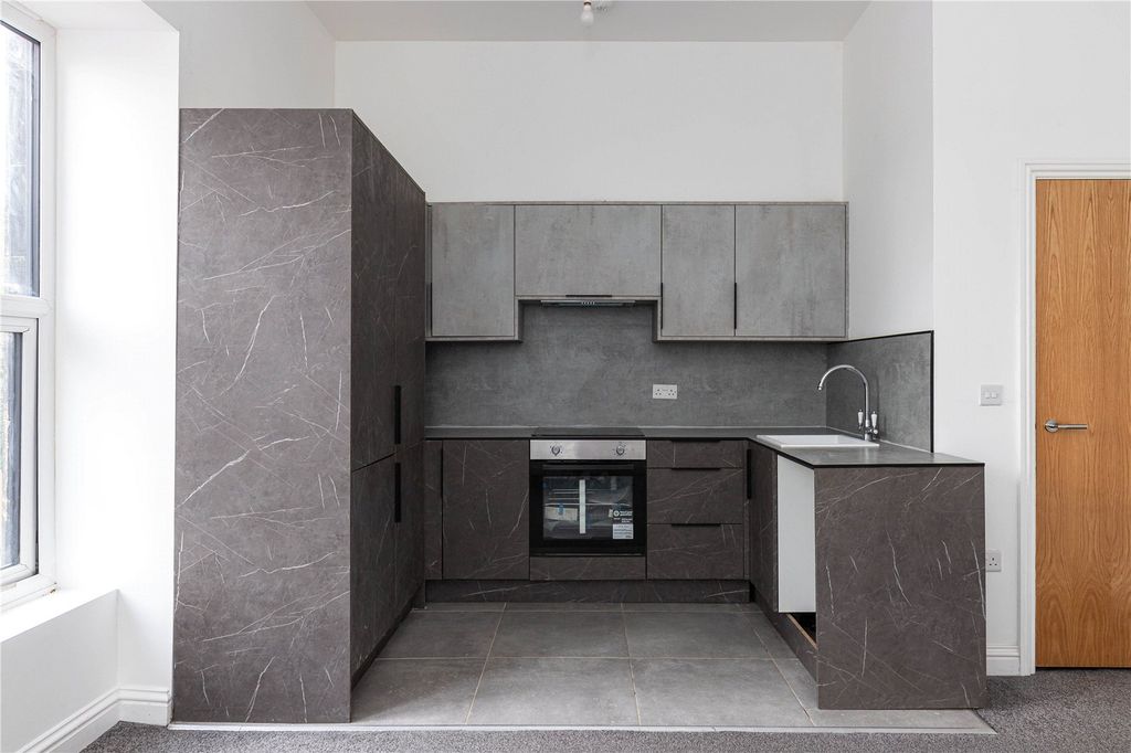 Property photo 1 of 11 Kitchen Area