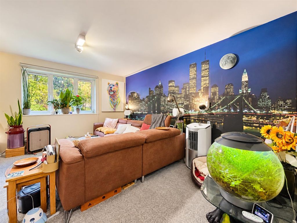 Property photo 3 of 8 Cosy Living Room With Cityscape Mural.Png