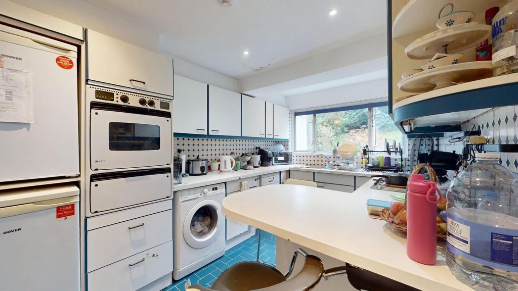 Property photo 2 of 12 A Bright And Well-Organized Kitchen With Ample Nat...