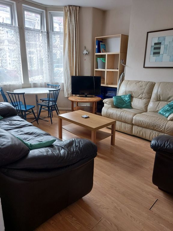 Property photo 2 of 16 A Cozy Living Room Featuring Comfortable Leather S...