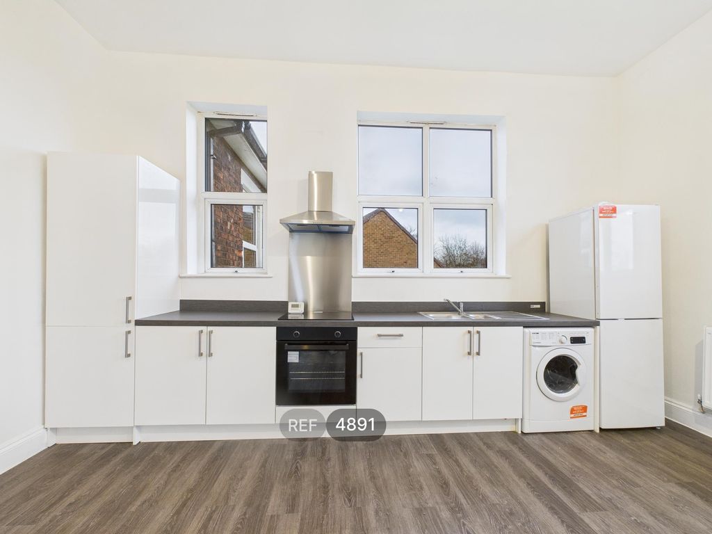 Property photo 2 of 12 Kitchen / Living Area