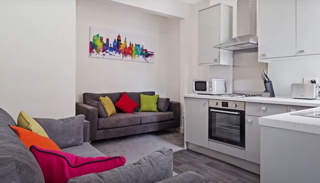 Property photo 2 of 8 A Modern, Cozy Living Room Combined With A Sleek K...