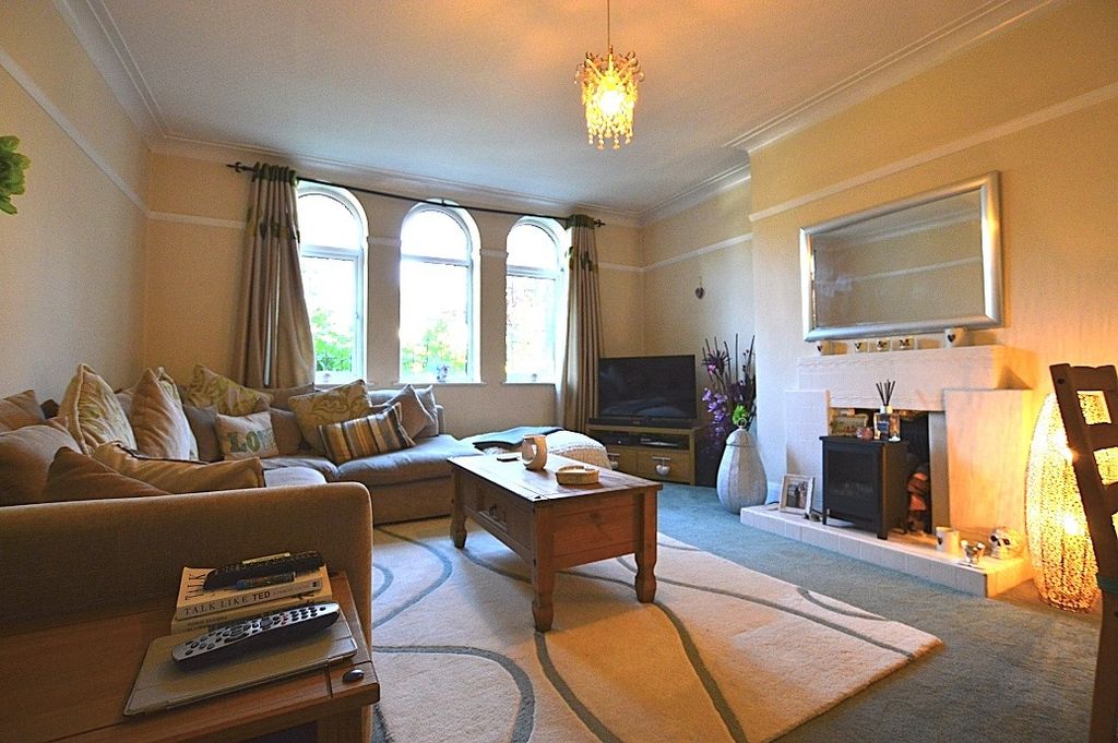 Property photo 3 of 8 A Cozy And Inviting Living Room Featuring A Large ...