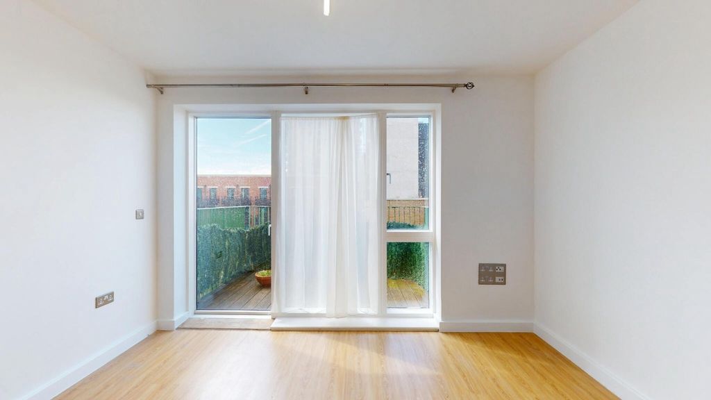 Property photo 1 of 15 Bright And Airy Living Room Featuring Large Glass ...